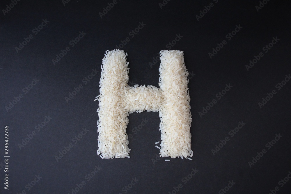 Letter H formed from rice grains