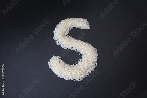 Letter S formed from rice grains © Gypsyaiko