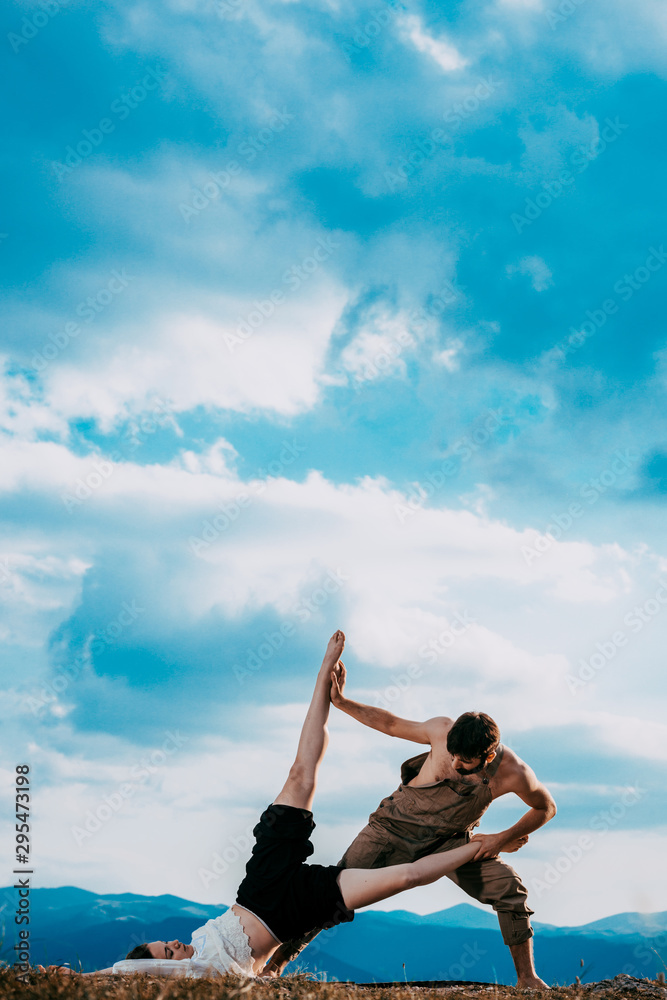 Happy romantic couple dancing open air under blue sky Happy romantic couple dancing open air under blue sky