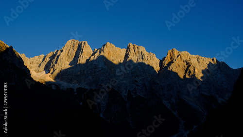 top of the mountain ridge in the late afternoon sun; Skrlatica mountain group in Julian Alps in Slovenia
