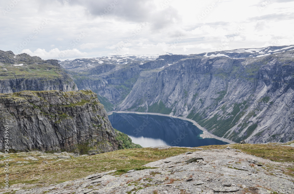 Blue glacier lake up in the mountains of Norway. Hiking trolltunga.