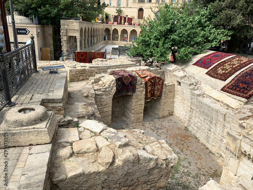 Baku, Azerbaijan. Inner city of Icheri Sheher, Asaf Zeynalli street. Fragment of ancient masonry at the walls of the Maiden tower photo