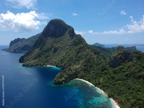 Tropical island and clear blue water from above. Paradise island © Catherines