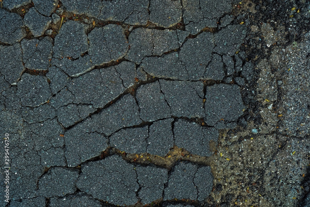 Obraz premium Close up Broken Asphalt Road Background.