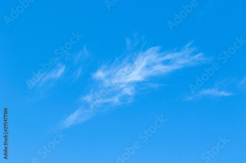 Cirrus clouds in the blue sky. Sunny day  calm weather