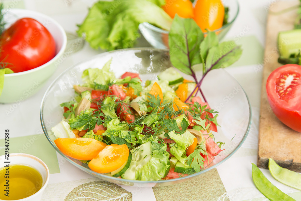 Healthy natural food, fresh salad with vegetables in plate Healthy natural food, fresh salad with vegetables in plate