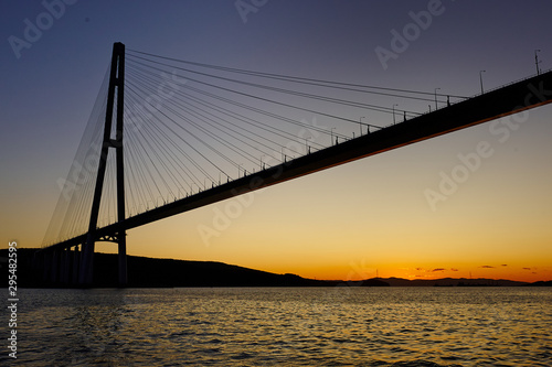 The silhouette of the cable-stayed bridge in Vladivostok, a beautiful view of the sunset © evafesenuk