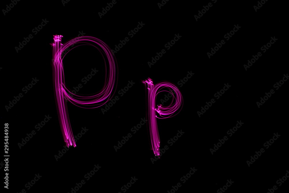 Long exposure photograph of the letter p in pink neon color, in upper case and lower case, parallel lines pattern against a black background. Light painting photography. Long exposure photograph of the letter p in pink neon color, in upper case and lower case, parallel lines pattern against a black background. Light painting photography.