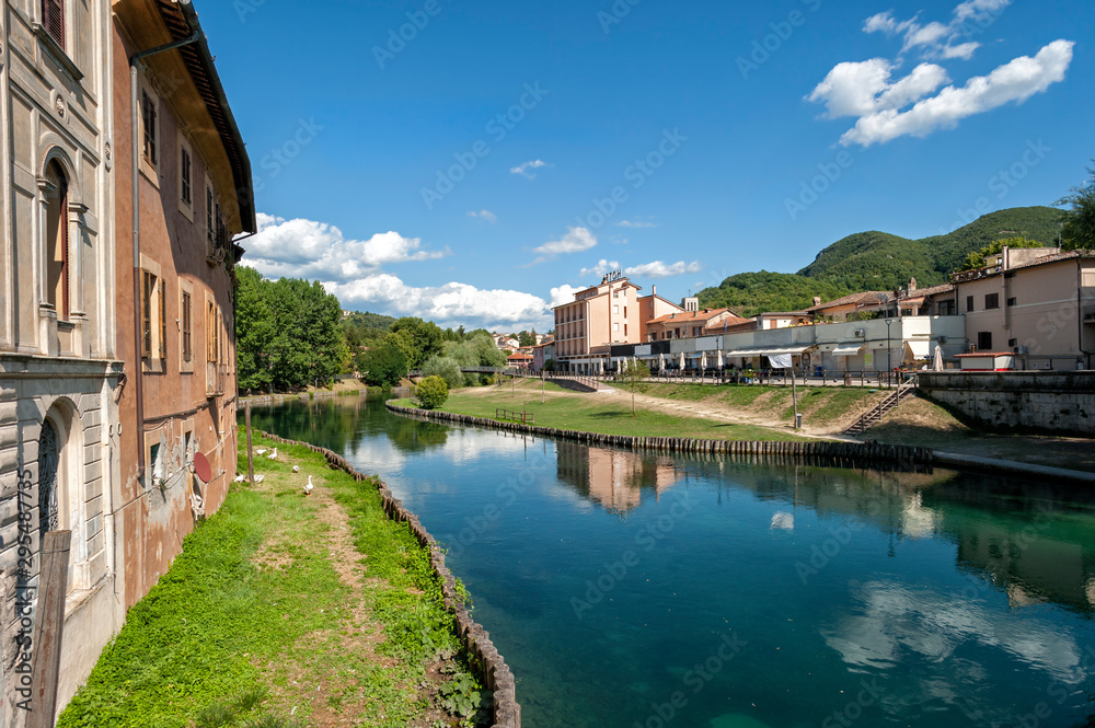 Rieti, city of central Italy. Velino river with old houses and geese that swim,