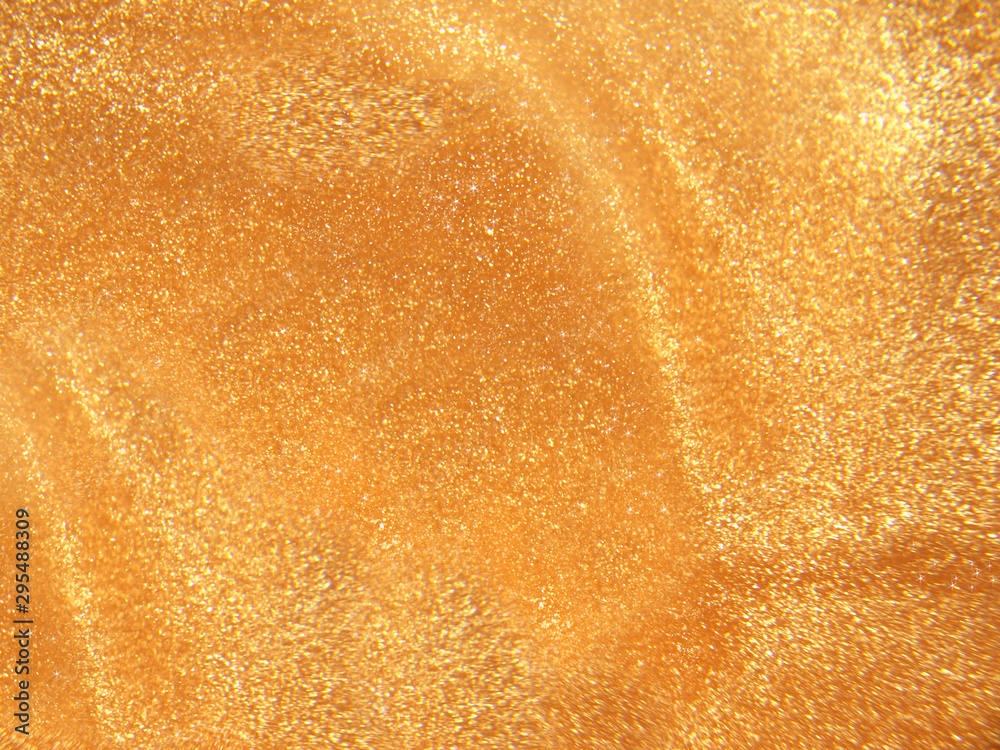 Pearlescent orange shiny background with glitter and shine. Pearlescent orange shiny background with glitter and shine.
