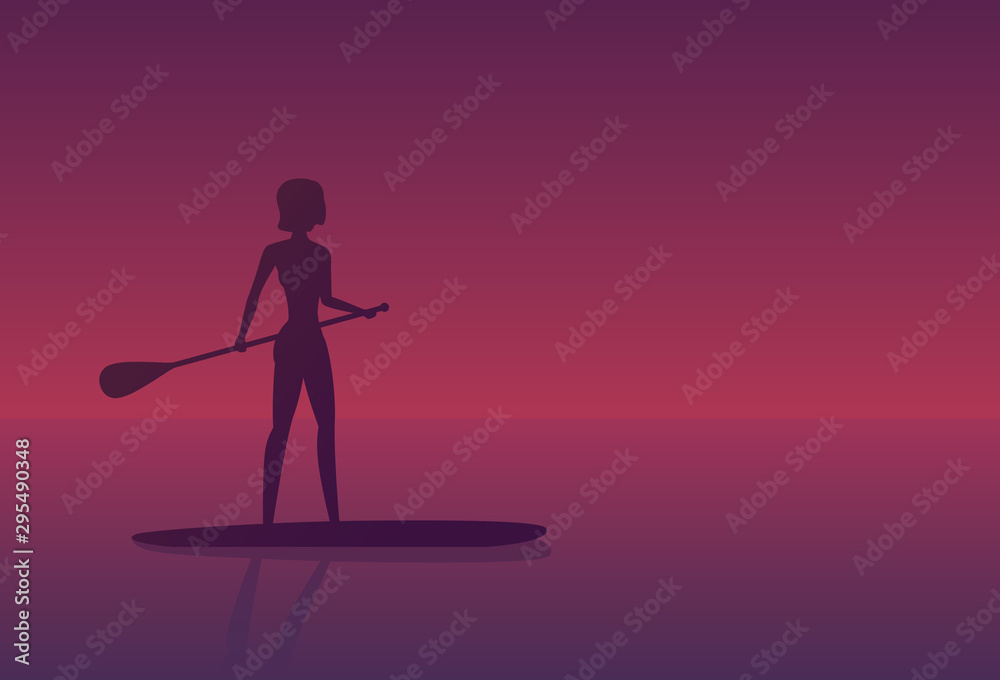 Girl on a sup board at sunset