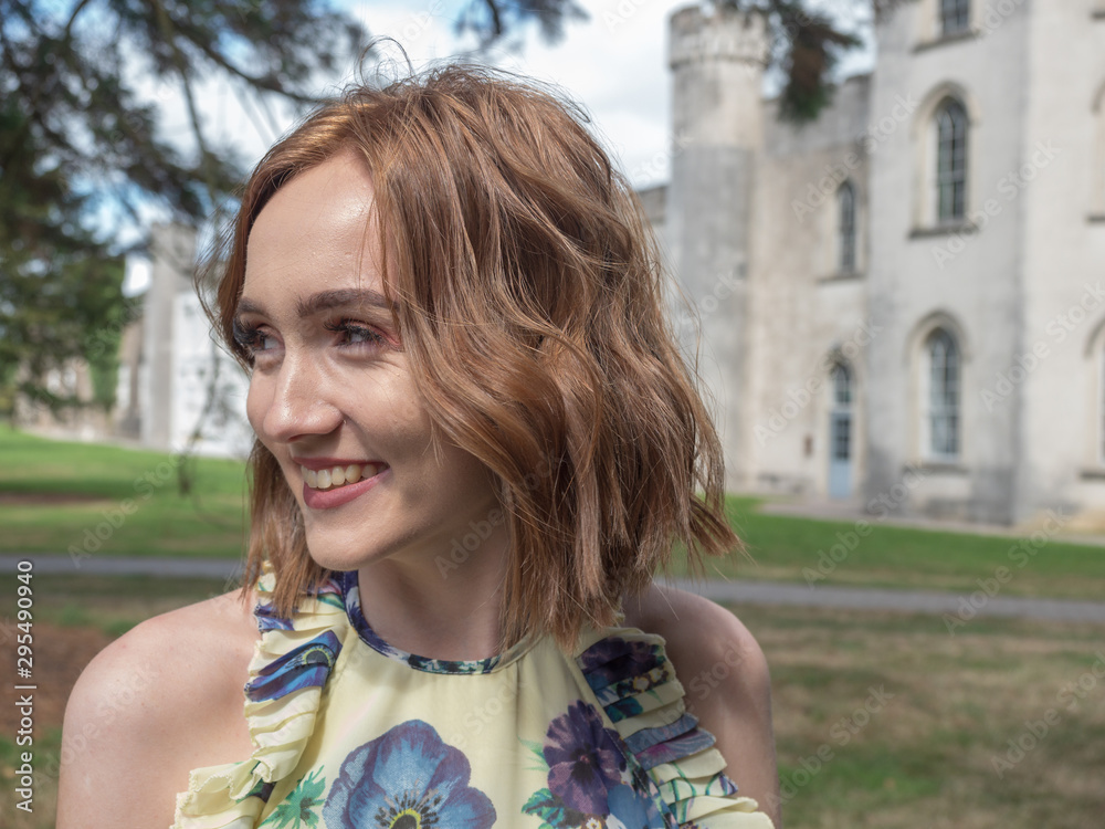 Young pretty Woman walking in the garden of an English Country Estate at a wedding Young pretty Woman walking in the garden of an English Country Estate at a wedding
