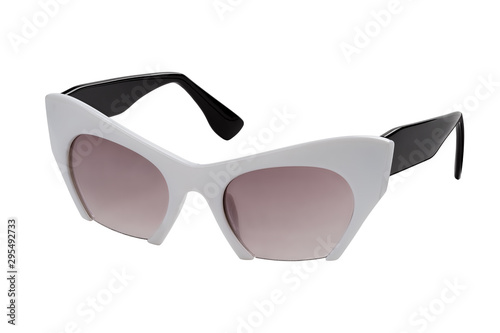 Stylish women's sunglasses with a black and white plastic frame isolated on a white background. View in half a turn. photo