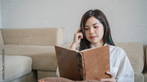 Portrait of a beautiful woman reading a book