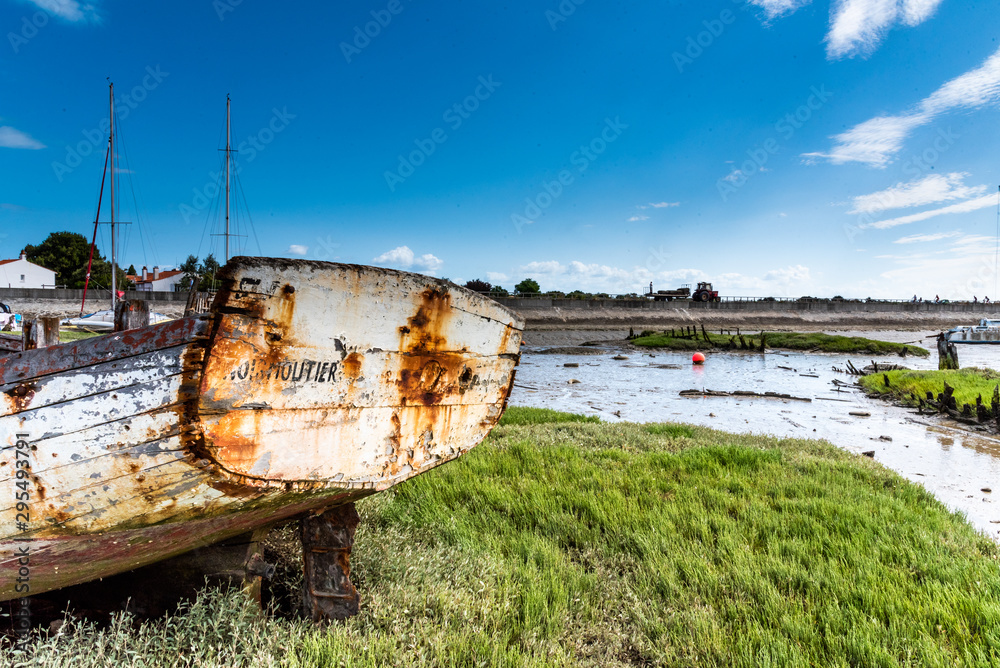 .The Noirmoutier boats cemetery. The stern of the wreck of an old wooden fishing boat still bears the name of its home port .The Noirmoutier boats cemetery. The stern of the wreck of an old wooden fishing boat still bears the name of its home port