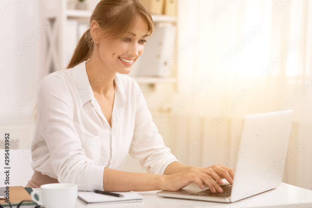 Businesswoman Typing On Laptop Working In Modern Office Businesswoman Typing On Laptop Working In Modern Office