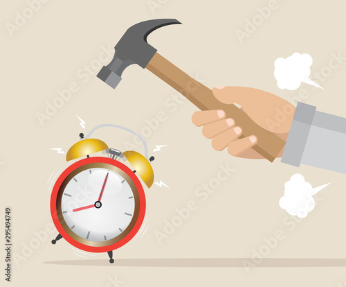 Hand with hammer trying to break alarm clock.