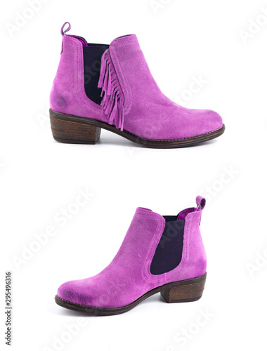 Female pink leather boots on white background, isolated product.