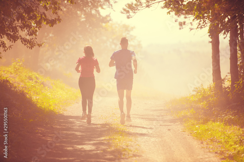young couple jogging on sunny day at nature © .shock