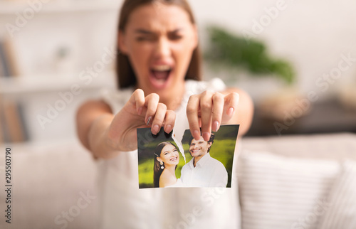 Photography Angry Woman Ripping Photo With Ex-Husband Indoor