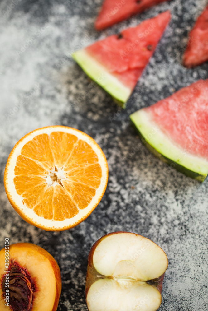 Watermelon slice on wooden cutting board summer fruit. Bananas and nictarin with apple on table. Healthy fruits. Sport eat and dieting. Watermelon slice on wooden cutting board summer fruit. Bananas and nictarin with apple on table. Healthy fruits. Sport eat and dieting.