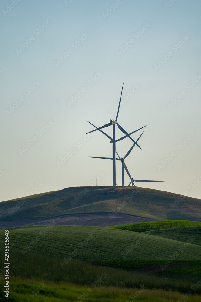 Wind turbines or windmills in the rolling farm fields of the Palouse in Washington State Wind turbines or windmills in the rolling farm fields of the Palouse in Washington State