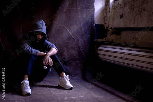 Cuadro en lienzo Woman sitting on the floor with substance abuse, substance abuse, addiction, people and drug use concept