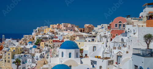 Pastel colorful lovely mediterranean city of Oia Santorini in Greece