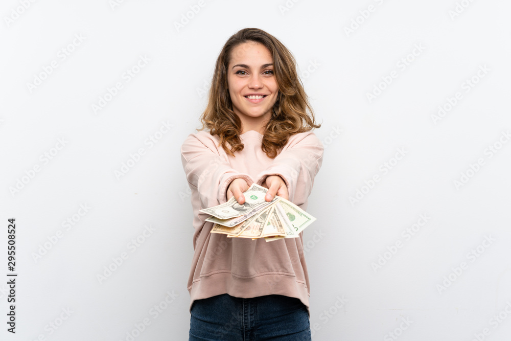 Young blonde woman taking a lot of money