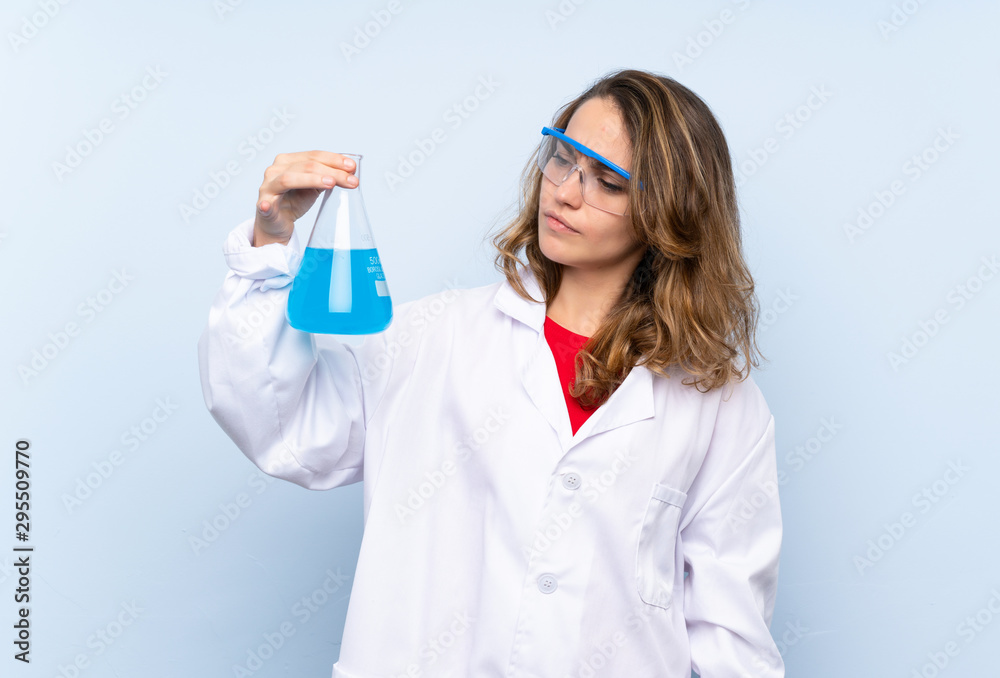 Young blonde woman with a scientific test tube Young blonde woman with a scientific test tube