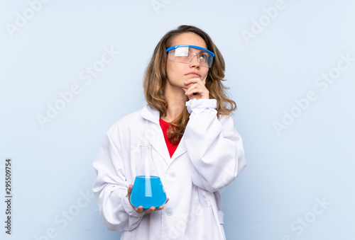 Young blonde woman with a scientific test tube