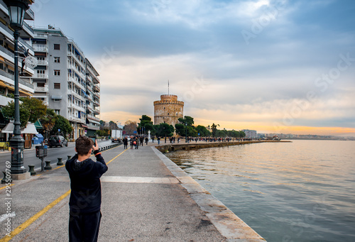 View of famous white tower and buildings of leoforos Nikis at  seafront. Thessaloniki, Greece . photo