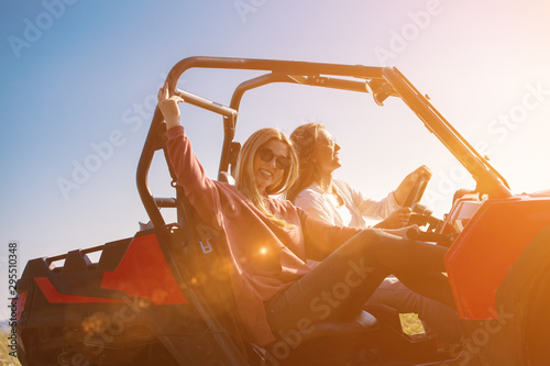 two young women driving a off road buggy car photo
