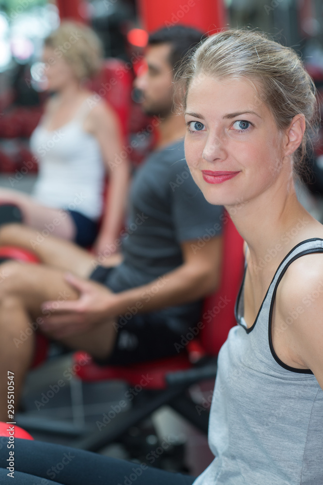 Fototapeta premium portrait of woman working out at gym