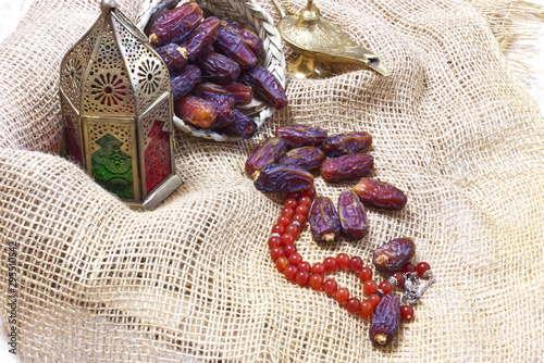 Ramadan kareem meaning Blessed ramadan with dates fruit in a Arabian continer  photo