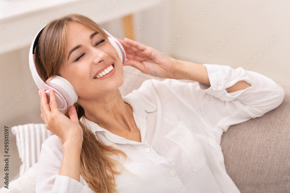Happy Girl In Wireless Headphones Enjoying Music At Home Happy Girl In Wireless Headphones Enjoying Music At Home