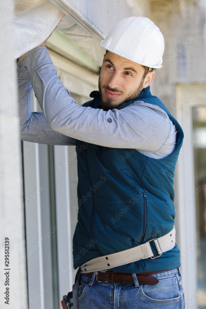 a builder is cladding a property a builder is cladding a property