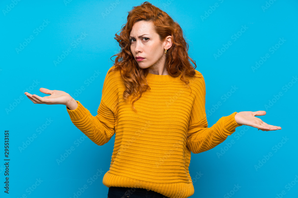 Redhead woman with yellow sweater unhappy for not understand something