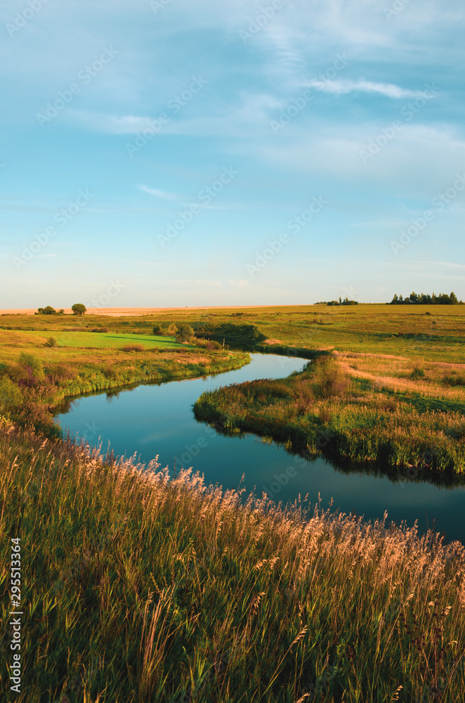 Summer sunset landscape with river bend