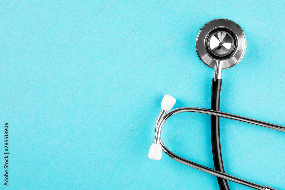 Stethoscope on blue background. Medical diagnostic device Stethoscope on blue background. Medical diagnostic device