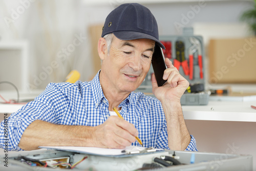 male technician on the phone