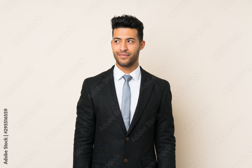 Young handsome businessman man over isolated background standing and looking to the side Young handsome businessman man over isolated background standing and looking to the side