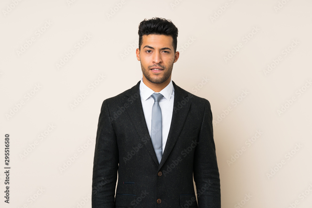 Young handsome businessman man over isolated background having doubts and with confuse face expression Young handsome businessman man over isolated background having doubts and with confuse face expression