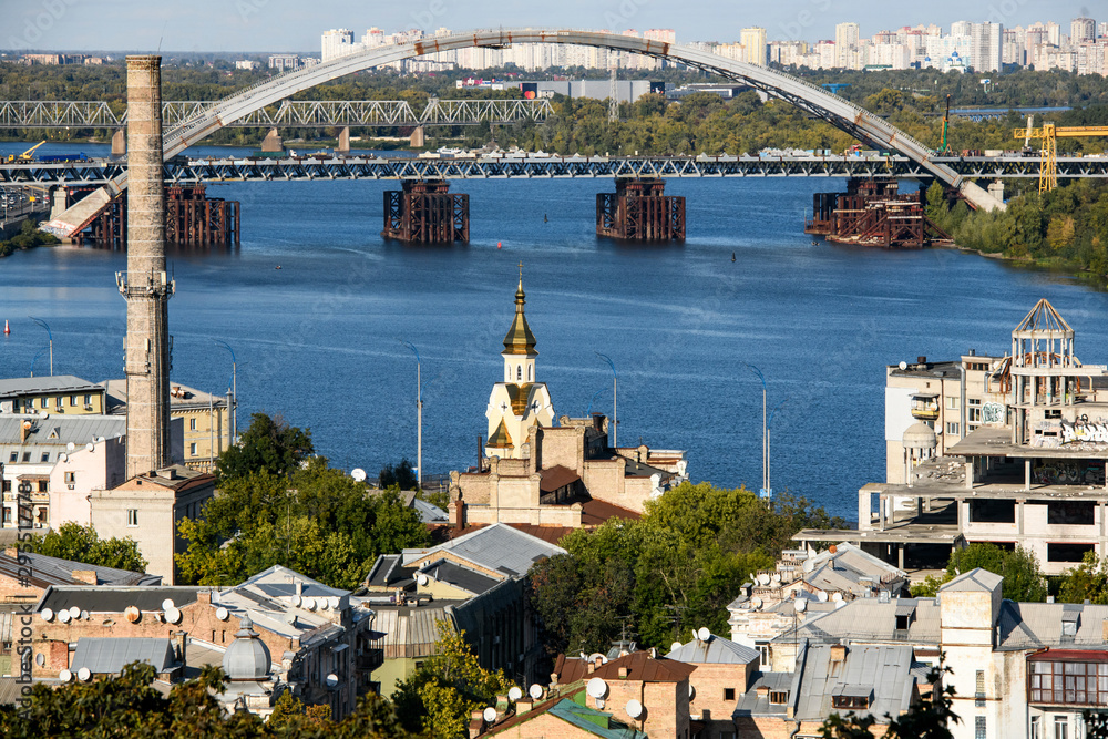 View of the old Podil district of the city of Kyiv and Dnipro River Dnieper with bridges. Ukraine, September 2019