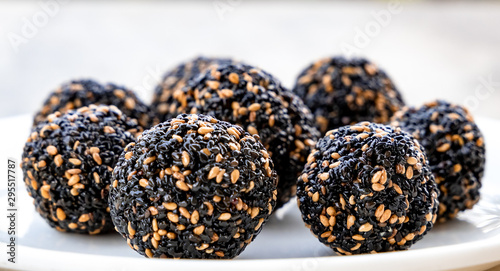 Til ke laddu or Sesame laddu isolated on a white background. Indian sweet photo