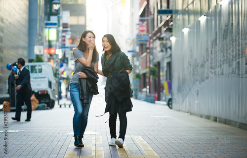 Two female friends meeting in Tokyo