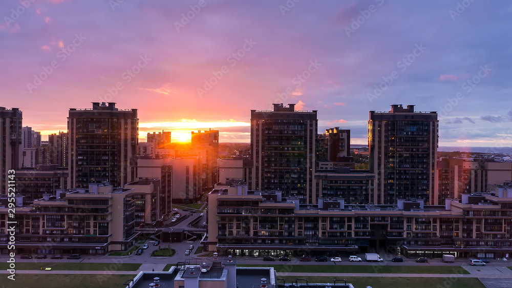 Urban city landscape with sunlight and buildings. Beautiful sunset view