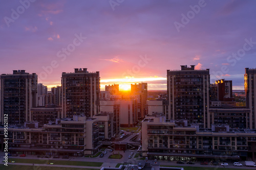 Sunset over city buildings in Saint-Petersbourg, Russia. Skyline view of cityscape with sunlight