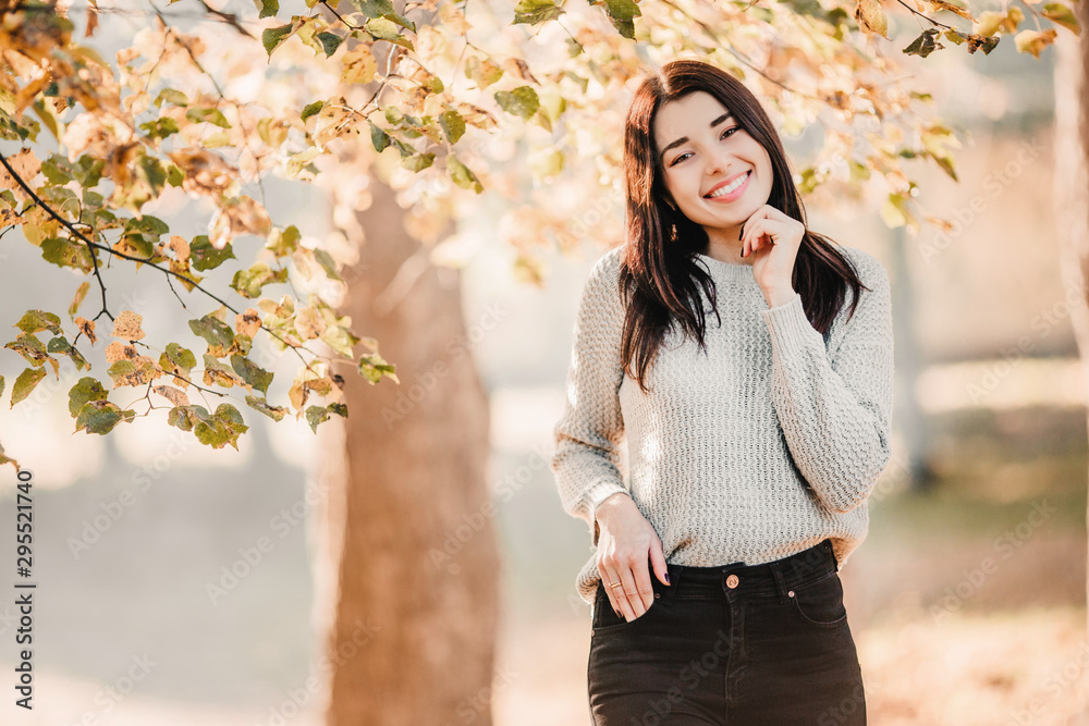 Beautiful woman having fun in fall park. Happy Autumn. Beautiful woman having fun in fall park. Happy Autumn.