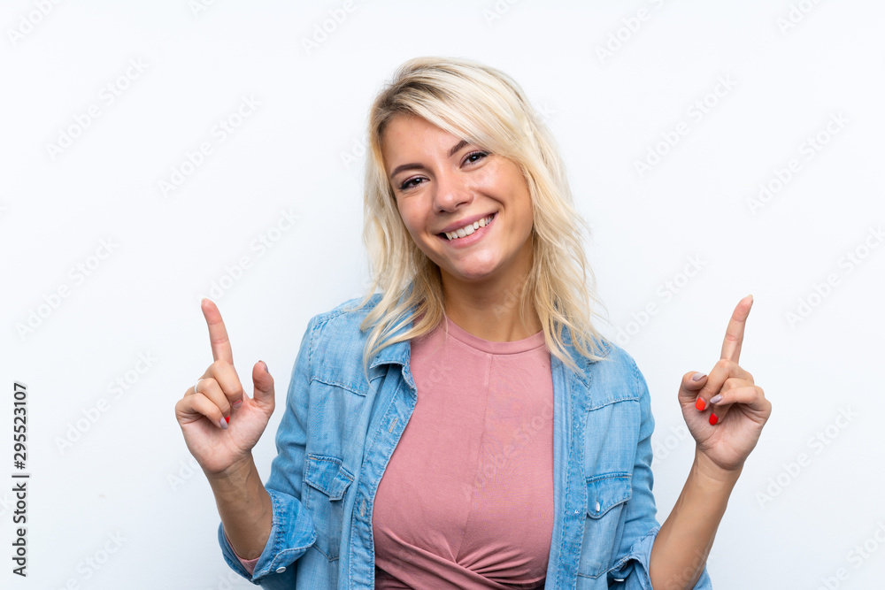 Young blonde woman over isolated white background pointing up a great idea Young blonde woman over isolated white background pointing up a great idea